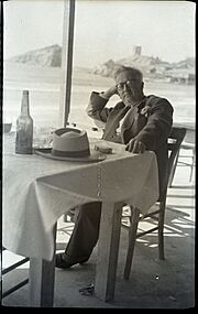 Reşad Ekrem Koçu at a table