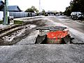 Storm drain pushed up through road in the 2010 Canterbury earthquake