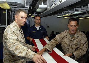 US Navy 090706-N-5712P-021 Gunnery Sgt. William Ward and Gunnery Sgt. Daniel Fowler, both embarked aboard the amphibious assault ship USS Nassau (LHA 4), teach Midshipman 1st Class William Fitzgerald, from the U.S. Naval Academ