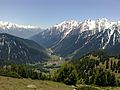 View of Aru Village enclosed by snow clad mountains from top of Birzamal