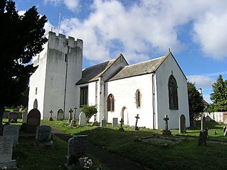 White painted church with square tower.
