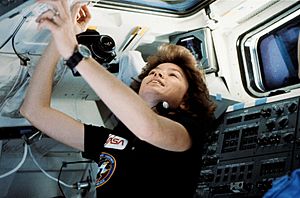 Astronaut Anna L. Fisher near the aft flight deck of Discovery on the STS-51-A mission