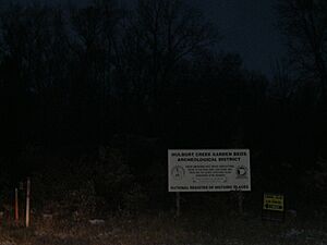 Hulburt Creek Garden Beds sign at dusk