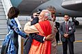 President Barack Obama, with First Lady Michelle Obama, greets Prime Minister Narendra Modi upon arrival at Air Force Station Palam