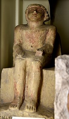 Seated statue of an official on block chair. Limestone. 6th Dynasty. From Egypt. The Petrie Museum of Egyptian Archaeology, London