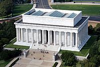 Aerial view of white memorial encircled by columns