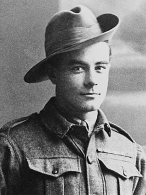 a head and shoulders portrait of a soldier in uniform wearing a broad-brimmed hat turned up on one side