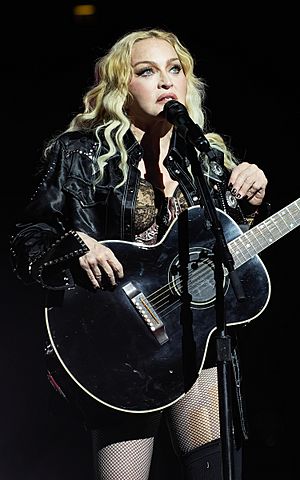 Madonna standing in front of a microphone