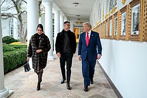 President Donald Trump walks with Cristiano Ronaldo and Georgina Rodríguez on the West Colonnade of the White House (54934520395)