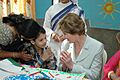 The First lady of USA, Ms. Laura Bush interacting with a child on her visit to Mother Teresa Light of Life Home (Jeevan Jyothi) for disabled children, in New Delhi on March 2, 2006