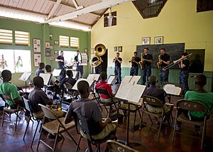 US Navy 110420-N-RM525-139 The U.S. Fleet Forces Band plays a song for the Alpha Boys School concert band during a Continuing Promise 2011 subject