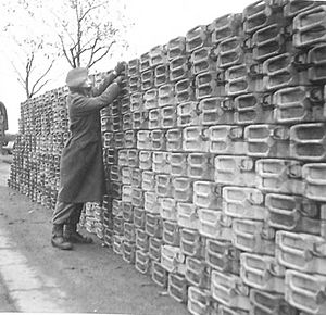 A stack of 'jerry' cans containing petrol awaiting collection by units