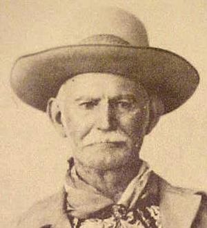 old man with moustache, wide-brimmed hat and bandana around neck