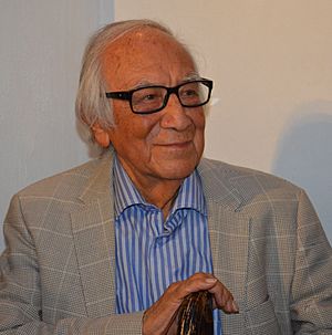 Arturo García Bustos speaking at a book presentation in the Palacio de Bellas Artes