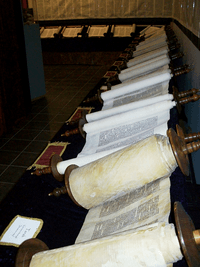 The Tanakh in traditional scroll form.