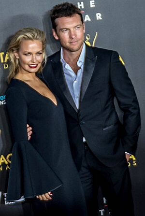 Lara Bingle and Sam Worthington on 2014 AACTAS Awards red carpet (cropped)