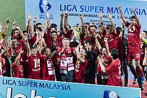 LionsXII captain Shahril Ishak receiving the 2013 Malaysia Super League trophy from Prime Minister Lee Hsien Loong, Jalan Besar Stadium, Singapore - 20130702