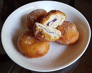 Philippine buñuelo (bunwelo) doughnuts with ube filling