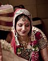 Shy smile of a bride in a Hindu wedding
