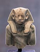 Upper part of portrait statuette of Amenemhat III wearing the nemes 01