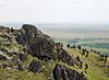 Rocky summit of Bear Butte and view over the Dakota plains.