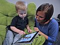 Child and mother with Apple iPad