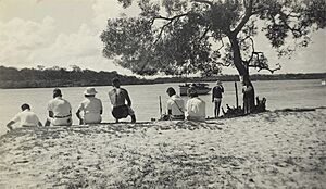 Holidaymakers sitting on the beach at Karragarra Island, 1937