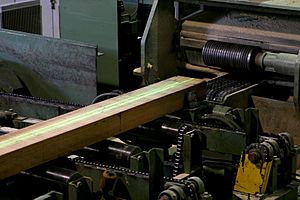 Laser guided cutting of wood in woodmill