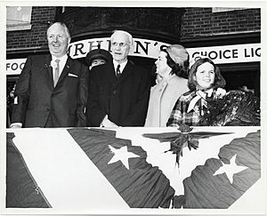 Mayor John F. Collins; John McCormack, Speaker of the House of Representatives; Mary Collins; daughter of John and Mary Collins in front of Amrheins Restaurant watching a St. Patrick's Day parade (12306414393)