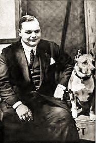 Roscoe "Fatty" Arbuckle with his dog Luke, c. 1919