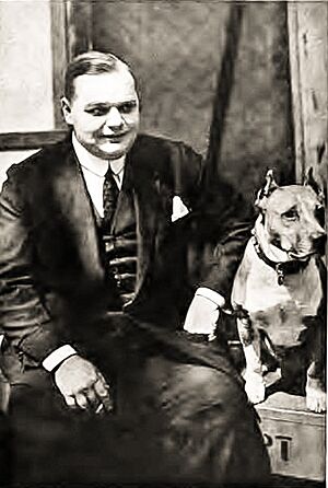 Roscoe "Fatty" Arbuckle with his dog Luke, c. 1919