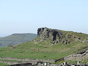 Picture of rocky crag with climbers