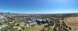 Aerial panorama of Royal Park. The Melbourne skyline sits on the left of the horizon