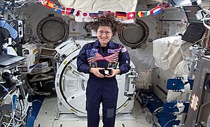 Christina Koch with commemorative coin