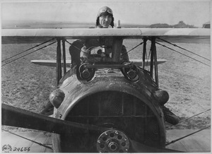 First Lieutenant E. V. (Eddie) Rickenbacker, 94th Aero Squadron, American ace, standing up in his Spad plane. Near... - NARA - 530773