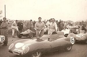 J Crosthwaite (with oily rag) and Graham Hill (on left of picture) with Lotus