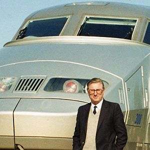 Paul Wild on track in front of TGV, France, 1989 (cropped)