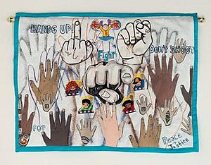 The Fist & The Finger, mixed-media quilt, created by NedRa Bonds, 2014