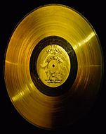 Photograph of the Golden Record in a black background.