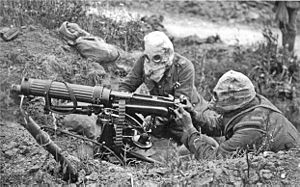 Vickers machine gun crew with gas masks