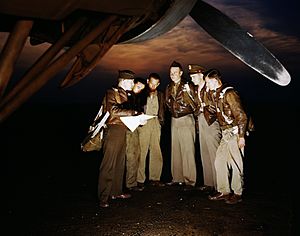 A combat crew receives final instructions just before taking off in a YB-17 bomber from a bombardment squadron base at the field, Langley Field, Va.