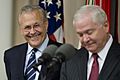 Donald Rumsfeld shares a laugh with Robert Gates