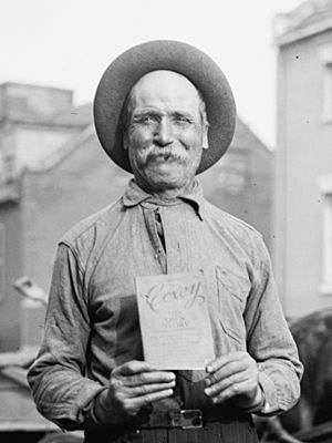 JACOB 'GENERAL' MONTGOMERY holding book entitled, "Coxey HIS OWN STORY" in 1914 - LCCN2016865547 (cropped)