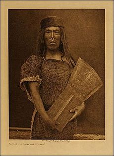 Kwakwaka'wakw man and copper shield, by Edward Curtis