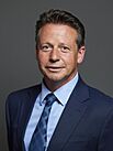 Official portrait of Nigel Huddleston MP crop 2, 2024.jpg
