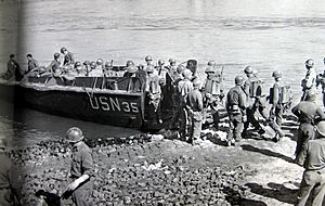 Rhine Crossing - U.S. Third Army infantrymen board a LCVP to cross the Rhine