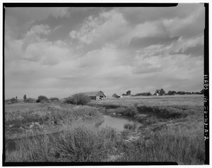 VIEW OF LANE BARN WITH RELATIONSHIP TO LITTLE WOOD RIVER. THE MAIN INTERSECTION OF RICHFIELD IS LOCATED THROUGH THE TREES IN THE RIGHT CENTER OF IMAGE. CAMERA IS POINTING NORTH HABS ID,32-RICHF,1A-2
