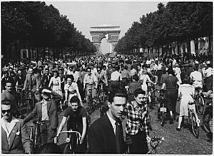 WWII, Europe, France, Civilians, "Hour of Triumph, Parisians join the parade down Champs Elysees from the Arch de... - NARA - 196298