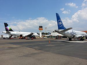 A Volaris A319 and an Aeromexico Connect Embraer 170 at Morelia International Airport tarmac.
