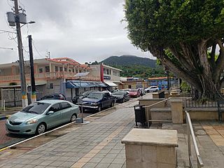 Cars parked around the plaza in Maunabo barrio-pueblo, Puerto Rico